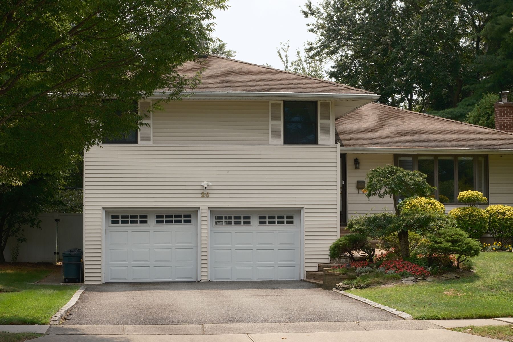 Suburban home with a white double garage door